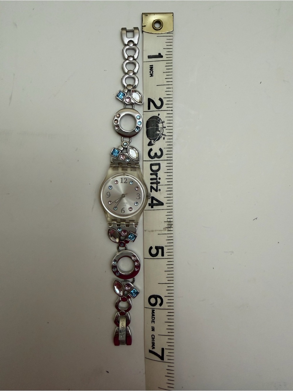 Swatch Silver Bracelet Watch with Blue and Pink Accents